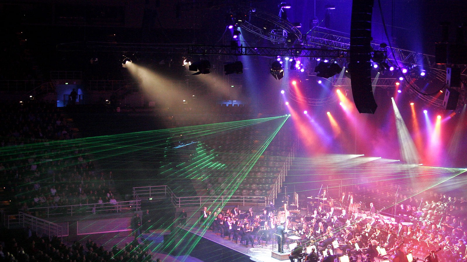 Concert stage with dramatic spotlights and production lighting